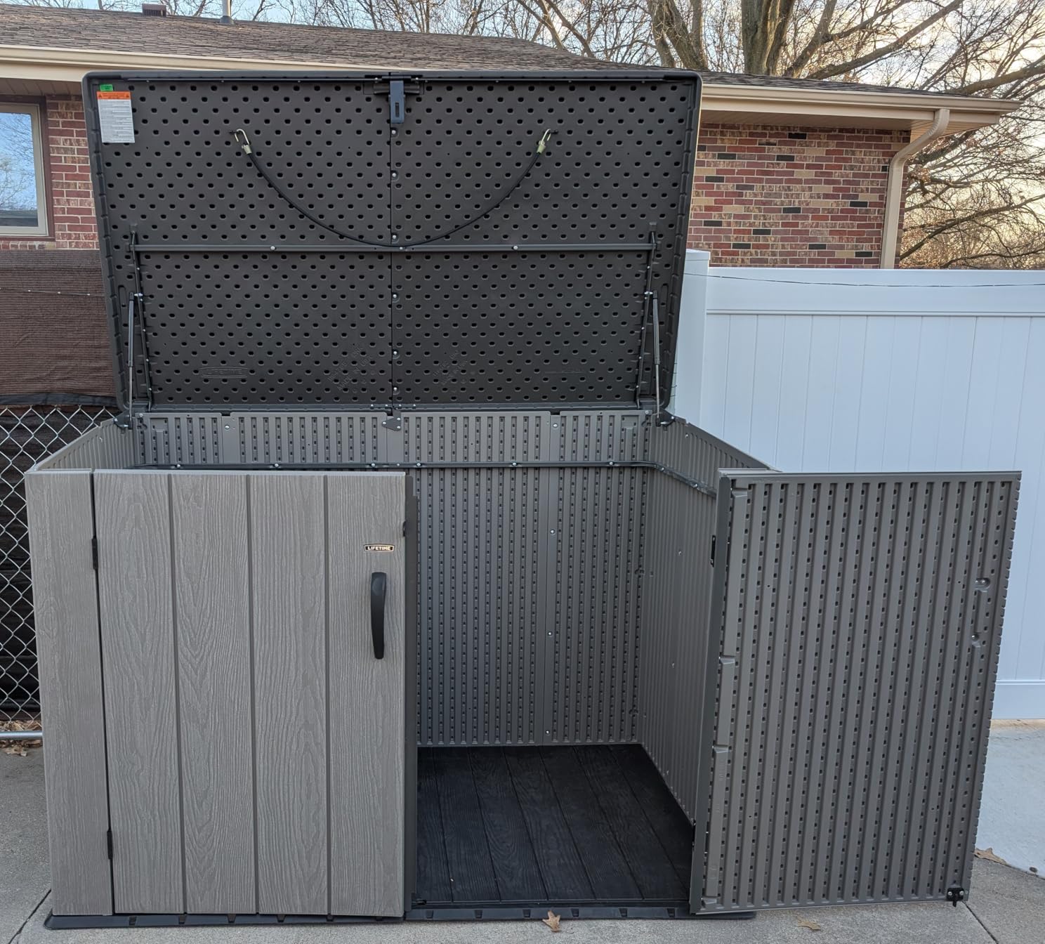 LIFETIME Horizontal Outdoor Storage Shed, Weather Resistant Resin Storage Can Fit Two Large Garbage Cans, Lockable Doors, Spring-Hinge Lid, Low-Maintenance Backyard Utility Shed customer photo 1