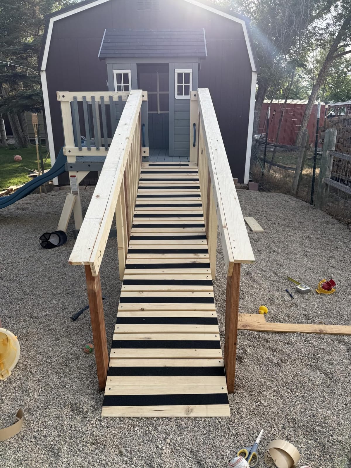 Backyard Discovery Echo Heights Elevated Cedar Wooden Kids Playhouse with Wave Slide, Play Kitchen, Wrap-Around Deck, Flat-Step Ladder, Half Door, Windows, Bell, and Growth Chart for Outdoor Play customer photo 1