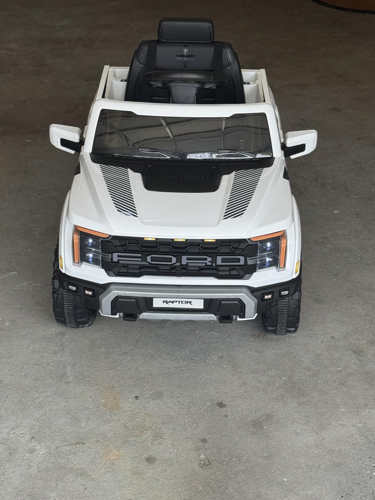 ENYOPRO 12V Kids Ride On Truck, Licensed Ford F-150 Raptor Toddler Electric Car w/Remote Control, Kids Ride On Car Toy w/LED Lights, Bluetooth Music, Lockable Doors, Safety Belt, 2 Speed (Black) customer photo 1