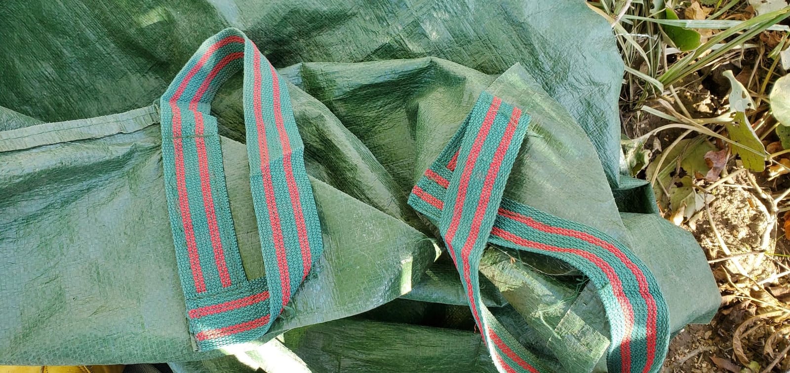 7x7 Ft Yard Garden Leaf Tarp W/ 4 Handles Waterproof Tarp for Sandbox Cover,Outdoor Tarpaulin,Lawn Debris,Landscape Pruning,Leaf Hauler,Tent Footprint,Camping Tent Mat,Patio Table,Yard Fire Pit Cover customer photo 1